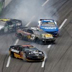 NASCAR halts Atlanta Cup race after huge crash collects half the field