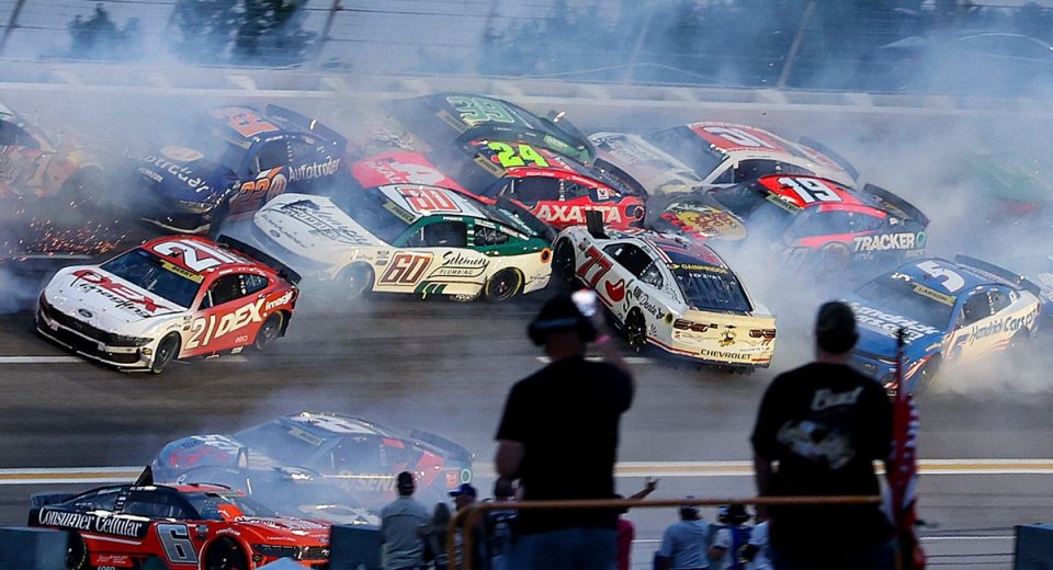 NASCAR halts Atlanta Cup race after huge crash collects half the field